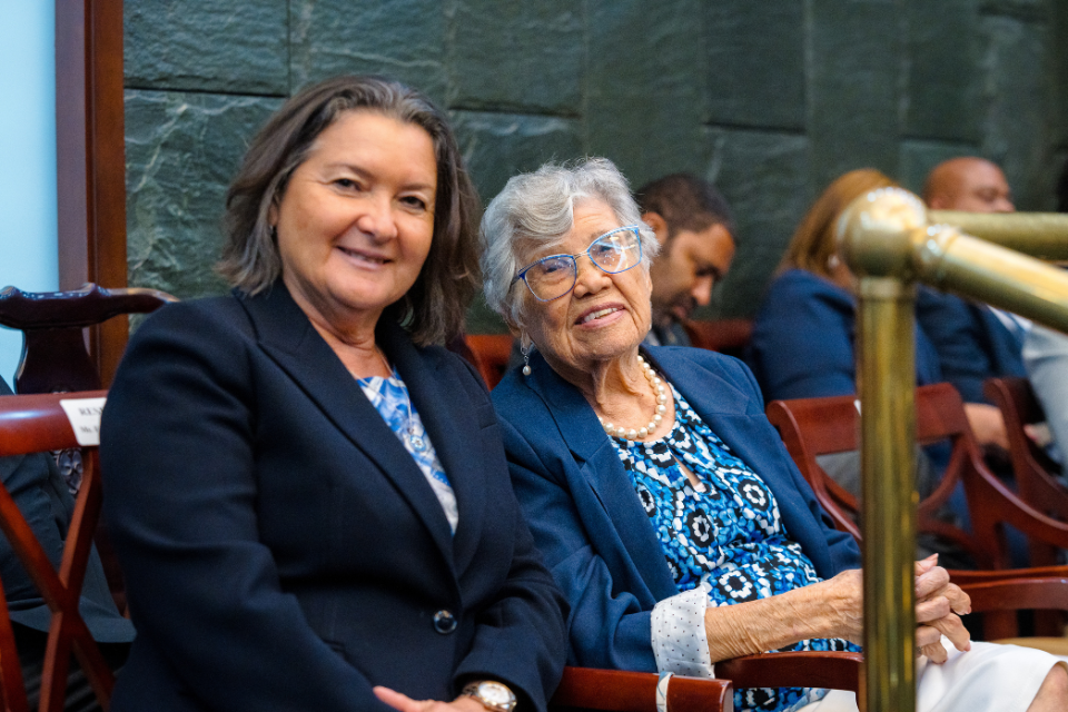 National Hero Mrs Francine Jackson (right) joined by her daughter Jennifer Dilbert at the swearing-in ceremony for Members of Parliament, Ministers and Cabinet Members yesterday.