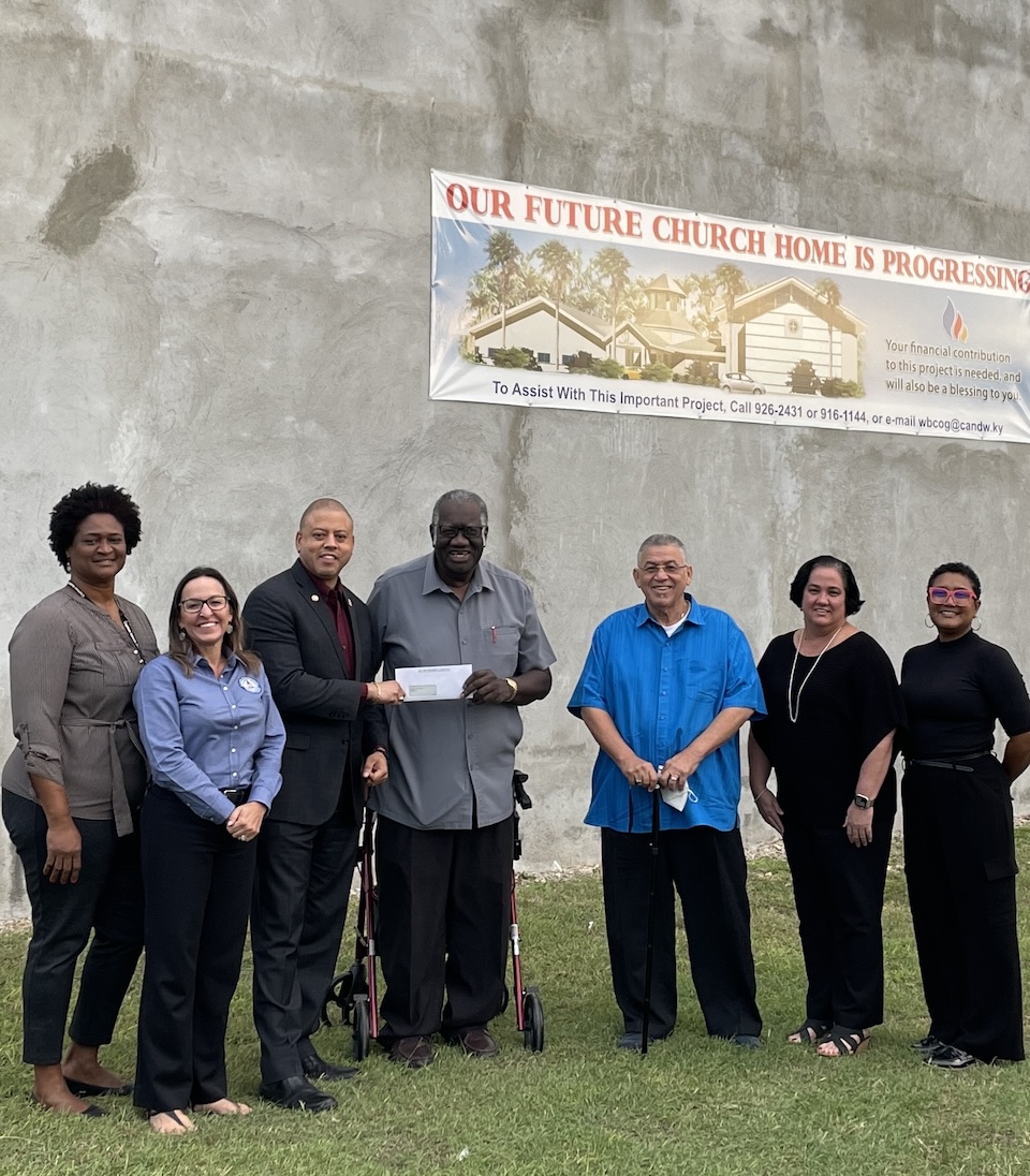 L-R: DCFS Community Development Officer for West Bay, Vanda Powery, Hazard Management Cayman Islands Director, Dani Coleman, Deputy Premier and Minister for Investment, Innovation and Social Development, the Hon. André Ebanks, Church of God Chapel in West Bay, Pastor Stanwyck Myles, The Honourable W. McKeeva Bush, MIISD Chief Officer, Tamara Ebanks and DCFS Director Paulinda Mendoza-Williams