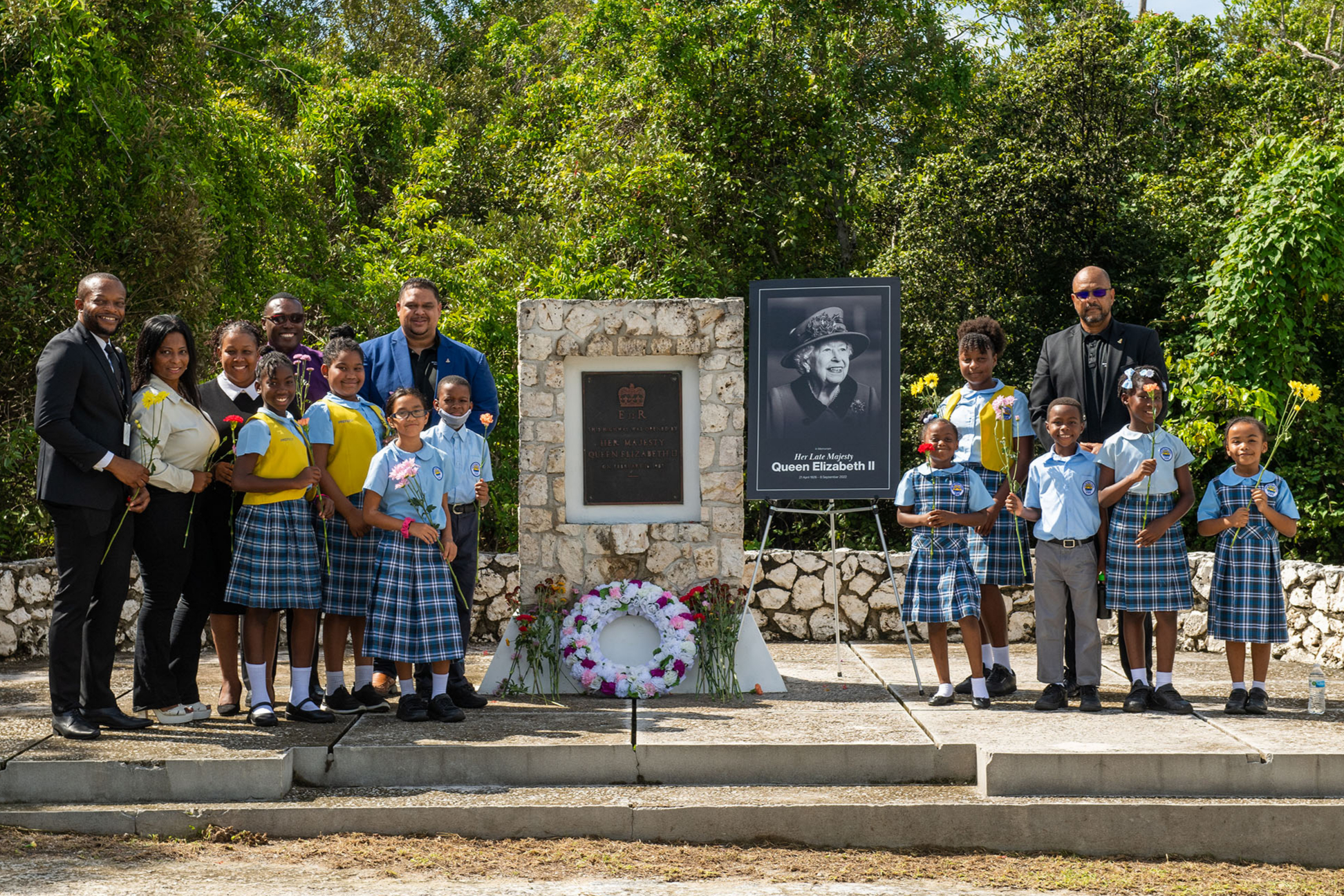 Minister Jay Ebanks and Parliamentary Secretary, MPs for North Side and East End,  respectively joined students for their tributes at Queen’s Highway Monument.